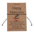 Detail of Halloween wish bracelet featuring a pumpkin charm on a brown card - Pumpkin with Hat Style