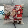 Housse de coussin de Noël avec motif Père Noël sur un canapé en tissu gris - Père Noël Vérifiant la Liste