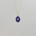 Detail of gold stainless steel necklace with blue stone pendant and engraved butterfly - Lapis Lazuli-Butterfly