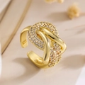 Close-up of golden irregular geometric ring with zircon pavé and twisted rope design - 14104 Intertwined Knot