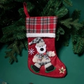 Red plaid Christmas stocking featuring a 3D polar bear patch and embroidered snowflake detail - Bear Style
