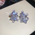 Macro shot of silver flower earrings with pear-cut zircon crystals and sparkling light - Silver-Butterfly (40#Patchwork Flower)