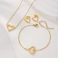 Detail shot of a heart-shaped jewelry set with necklace and bracelet in golden finish - Heart Gold