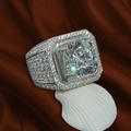 Detailed view of luxury men's ring with large square zircon and pavé diamonds on shell - US 7