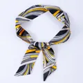 Narrow silk scarf featuring abstract geometric patterns in yellow and black tones - X30-Multi