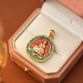Vintage gold pendant with red and green enamel Buddha design in a pink jewelry box - Red Green and White Religious Buddha Style