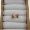 Natural orange-pink stone stud earrings with gold four-prong setting in jewelry box - Red Agate