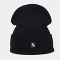 Detail of the white letter N embroidery on a black ribbed knit beanie for men and women - Black