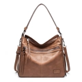 Detail of vintage brown tote bag featuring dual front zipper pockets and leather tassels - Single Bag / Khaki