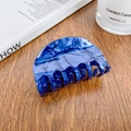 Blue marble texture acetate hair claw clip with rounded shape on a wooden background - 6.8cm / Sapphire Blue