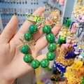 Detail of green beaded keychain with transparent bow and cute bear charm pendant - Dark Green