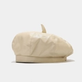 Side view detail of a cream PU leather beret hat with a small top tail - One Size / Khaki