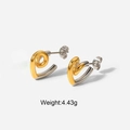 Detail showing two-tone twisted heart earrings in gold and silver steel with weight specs - Two-tone Gold Heart