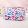 White waterproof PU leather makeup bag with colorful floral prints and gold zipper - White Background Heart Watercolor Flowers