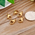 Five gold stainless steel lobster clasps for DIY jewelry making on wood background - 10mm / Gold