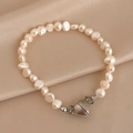 Baroque pearl bracelet with silver heart magnetic clasp on champagne silk fabric - Heart Magnetic Pearl Style