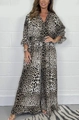 Detailed close-up of leopard print wide-leg jumpsuit with ruffled cuffs and elastic waist - S / Top And Bottom / Cream