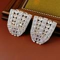 Macro shot of silver-tone irregular fan earrings with sparkling pavé-set crystals - Clip-on Earrings / Silver