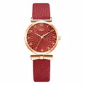 Detail of rose gold watch face with sunburst flower texture and red leather strap - Watch Only / Red