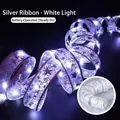 Cinta navideña LED plateada con luces blancas y patrones de estrellas a pilas - 5m 50 LEDs + Caja de Batería / Cinta Plateada Luz Blanca