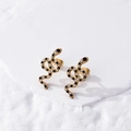 Schlangenförmige goldene Edelstahlohrringe mit schwarzen und weißen Kristallen - Schlangenstecker