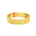 Macro detail of golden magnetic bracelet showing engraved patterns and inner therapy stones - Gold