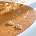 Elegant silver tassel earrings with rhinestone stars on brown leather background - Silver Triple Star Drop Earrings (N-373)