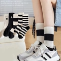 Women's cotton crew socks in solid black, white and striped patterns for daily wear - One Size / Black and White Stripes