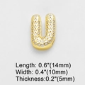Macro shot of gold letter U pendant with cubic zirconia and detailed size measurements - Letter U