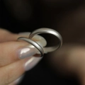 Minimalist matte 925 sterling silver couple rings set shown being held by a hand - Silver Narrow Matte Ring (J3701)
