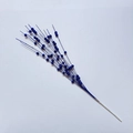 Macro detail of artificial Christmas glitter berries in deep blue on white stem - Sapphire Blue