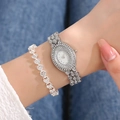 Detailed view of silver oval watch and heart bracelet set with sparkling crystals - Silver Watch + Silver Bracelet