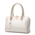 Elegant cream patent leather Boston handbag with woven handles and gold hardware - Off White