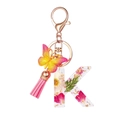Letter K resin keychain with dried flowers, gold foil, pink butterfly, and tassel charm - Flower Pattern K