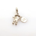 Macro detail of silver scarecrow charm with Love guard engraved tag and crystal joints - Silver Scarecrow
