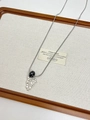 Detail of silver snake chain necklace with black bead and cluster of metallic teardrop pendants - Style H Black Floral Bead Necklace