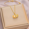 Golden shell pendant necklace with white pearl and sparkling crystals on jewelry box - 6038 Shell Pearl / Gold