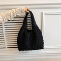 Minimalist black puff cloud handbag featuring unique bubble texture and soft handle - Black