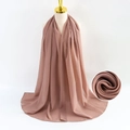 Dusty rose pearl chiffon hijab scarf displayed on a gold neck mannequin with fabric detail - Flesh Pink