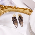Dark grey butterfly wing earrings with gold leaf accents on a vintage gold frame - Black-Gold Foil