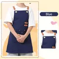 Waterproof navy blue canvas apron featuring adjustable brown leather straps and pockets - Kids / Blue