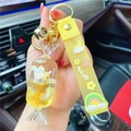 Yellow liquid sand candy keychain with white cat doll and silicone wish wrist strap - Yellow-Fruit Candy Unicorn