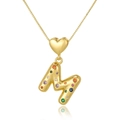 Macro shot of gold M-letter pendant with colorful zircon stones and heart link - M