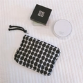 Close-up of a small canvas pouch with black gingham pattern and a simple wish label - Black Geometric