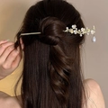 Vintage gold hair pin with white plum blossoms and dangling pearls on elegant bun hairstyle - F0570 Plum Blossom