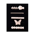 Detail view of 5-piece rose gold hair clip set with rhinestones on a black background - Flower Butterfly and Heart Design (D3014) / Black Sponge Packaging
