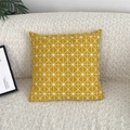 Detail of yellow geometric triangle pattern on linen pillowcase against bouclé sofa - Yellow Geometric (Insert Not Included)