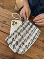 Elegant tweed clutch bag in black and white weave with a white pearl wristlet handle - Tweed Black White