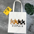Detailed view of white canvas tote bag featuring cute cartoon Corgi print with Corgis text - Friends Style CORGIS