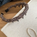 Detail showing brown knitted wool headband texture and anti-slip teeth on beige book - Dark Coffee